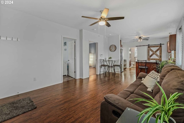 living room featuring ceiling fan and dark hardwood / wood-style floors