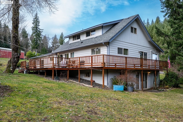 22726 Cedar Grove Rd, Clatskanie, OR 97016 - back of house with a shingled roof, a wooden deck, and a lawn