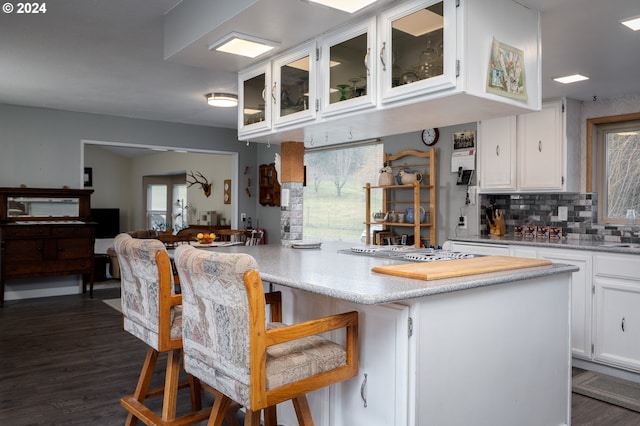 22726 Cedar Grove Rd, Clatskanie, OR 97016 - kitchen with healthy amount of natural light, white cabinetry, and dark wood finished floors