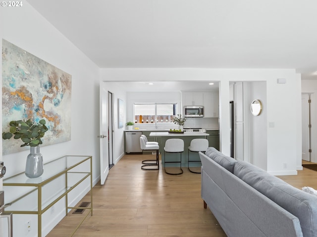 living room with light hardwood / wood-style flooring