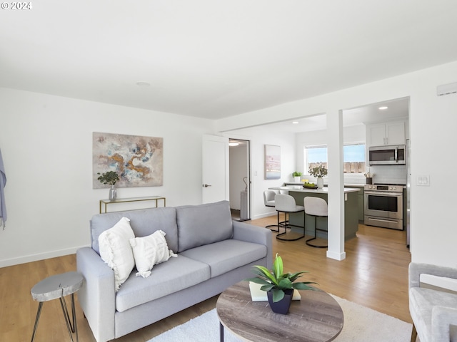 living room with light hardwood / wood-style floors