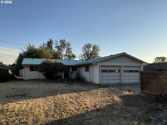 single story home with a garage