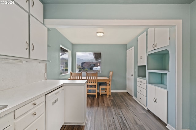 kitchen with dishwasher, dark hardwood / wood-style flooring, kitchen peninsula, and white cabinetry