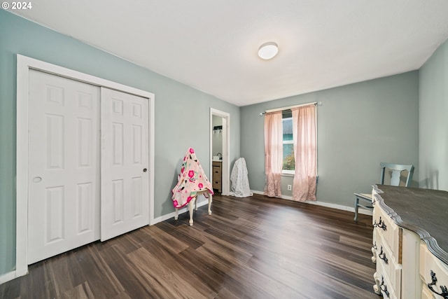 unfurnished bedroom featuring a closet and dark hardwood / wood-style floors