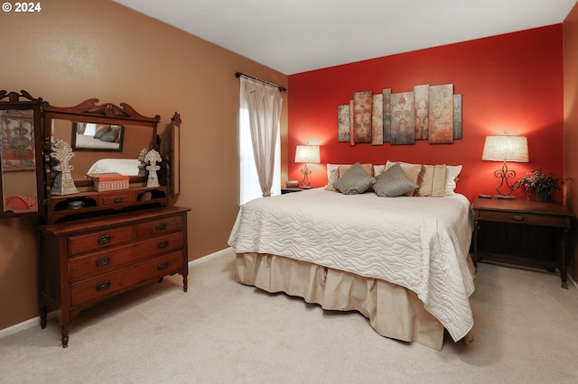 bedroom featuring light colored carpet