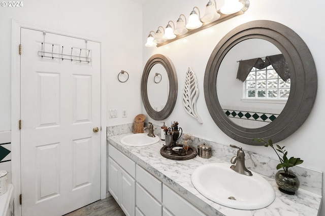 bathroom with hardwood / wood-style flooring and vanity