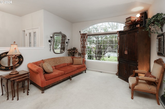 sitting room featuring light colored carpet