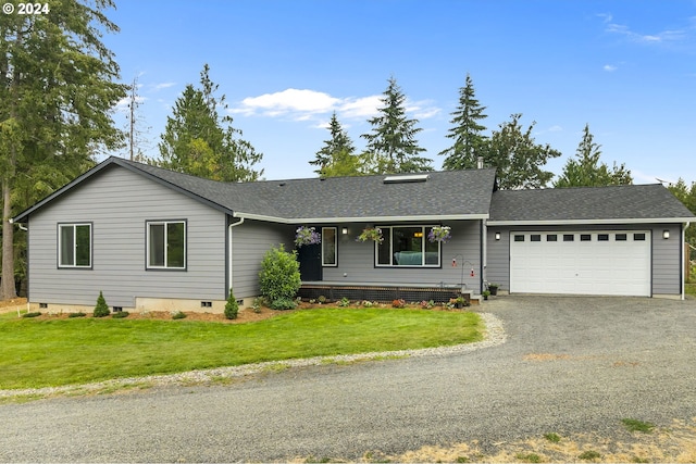 single story home featuring a garage and a front yard