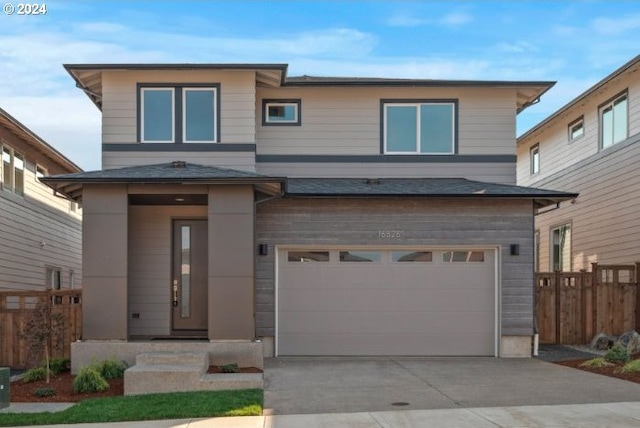 view of front of property with a garage