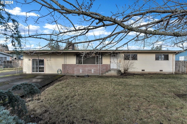 ranch-style home with a front yard