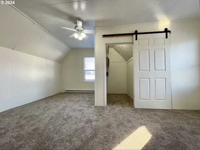 bonus room with carpet flooring, a barn door, ceiling fan, and vaulted ceiling