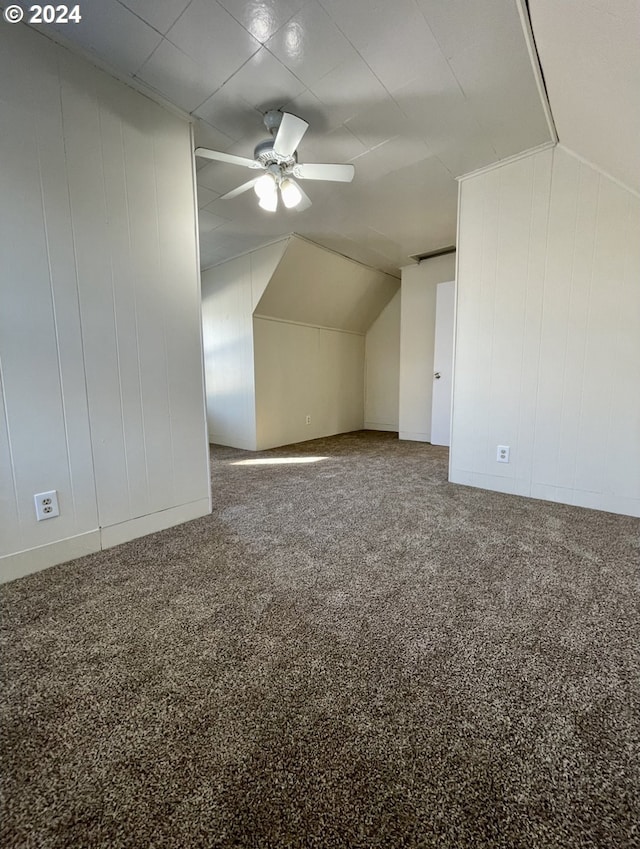 bonus room with carpet floors, vaulted ceiling, and ceiling fan