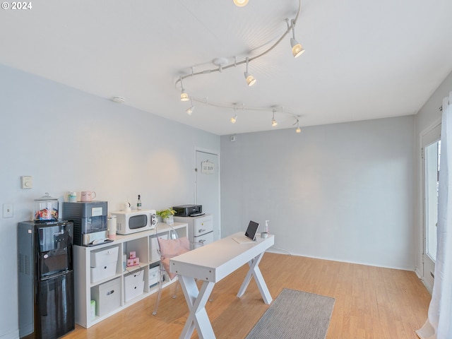 home office featuring light hardwood / wood-style floors