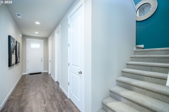 corridor with wood-type flooring