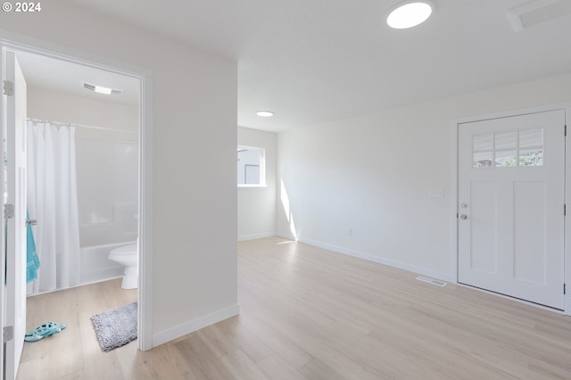 entrance foyer with plenty of natural light and light wood-type flooring