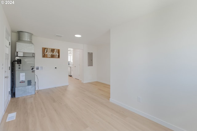 interior space with heating utilities and light wood-type flooring