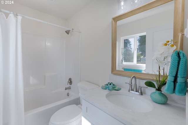 full bathroom with vanity, toilet, and shower / bath combo with shower curtain