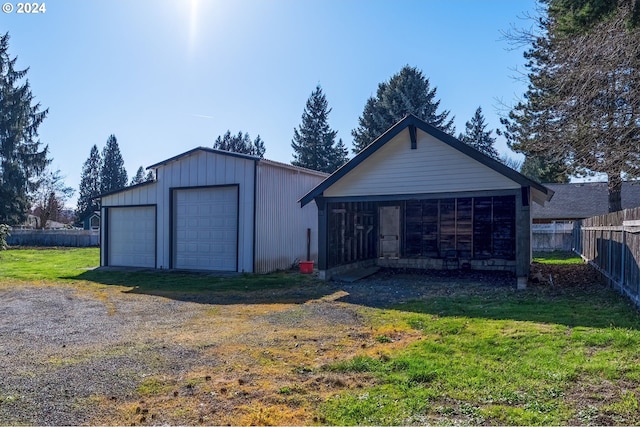 exterior space featuring a yard and a garage