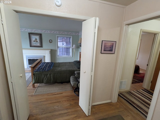 bedroom with hardwood / wood-style flooring