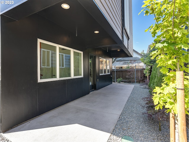 view of side of property with a patio