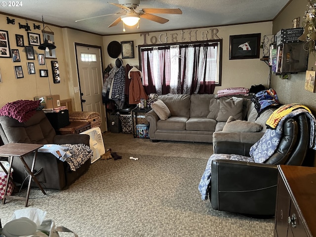 living room featuring plenty of natural light, a textured ceiling, ceiling fan, and light colored carpet