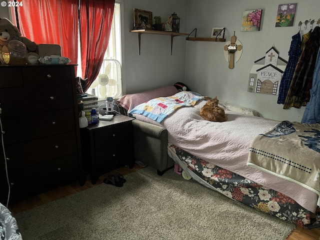 bedroom with hardwood / wood-style flooring