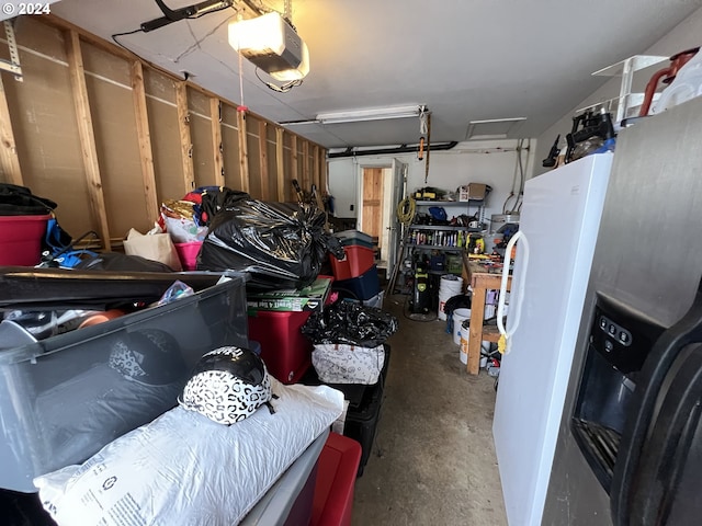 garage with a garage door opener and fridge