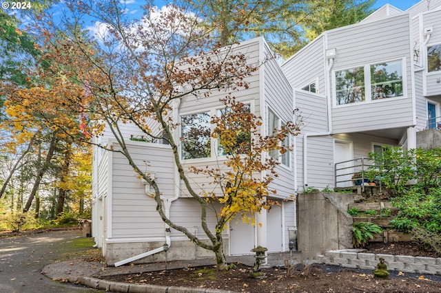 view of side of home featuring a garage