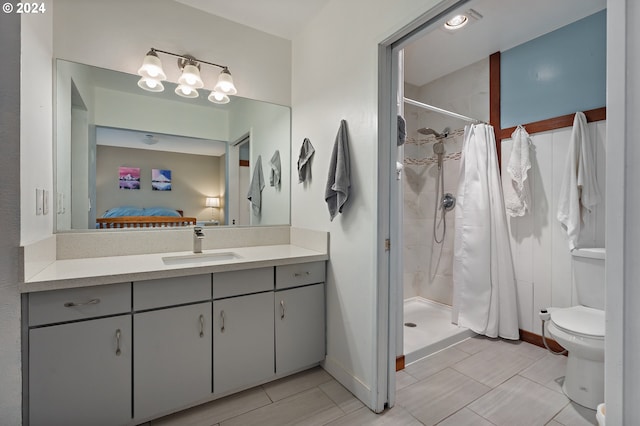 bathroom with vanity, toilet, and a shower with shower curtain