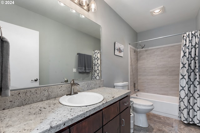 full bathroom featuring shower / bath combination with curtain, vanity, and toilet