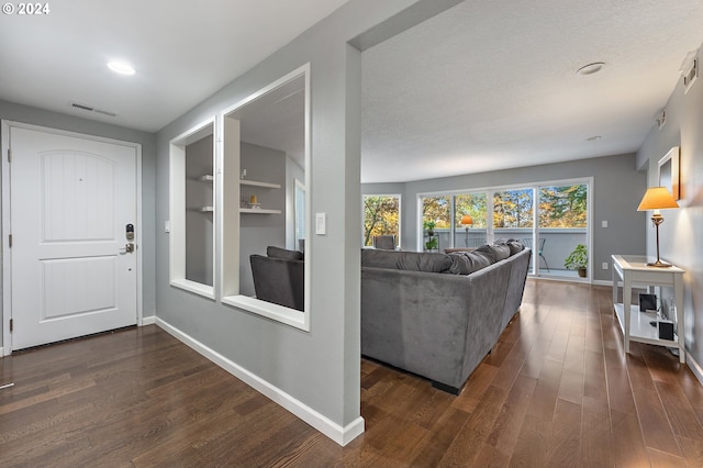 living room with dark hardwood / wood-style flooring