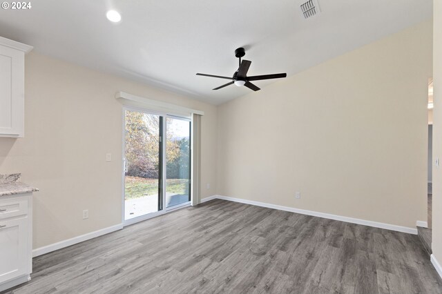 interior space with ceiling fan and light hardwood / wood-style flooring