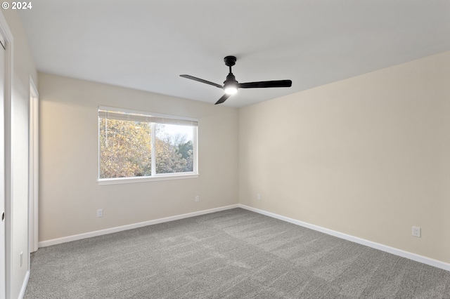 carpeted empty room with ceiling fan