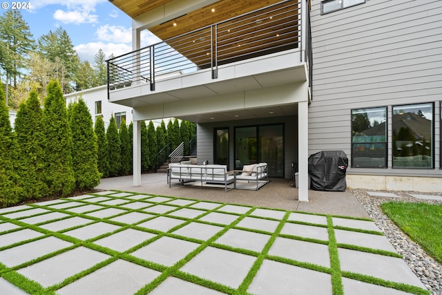 view of patio with grilling area, a balcony, and an outdoor hangout area