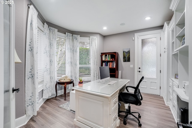 office space with light wood-type flooring