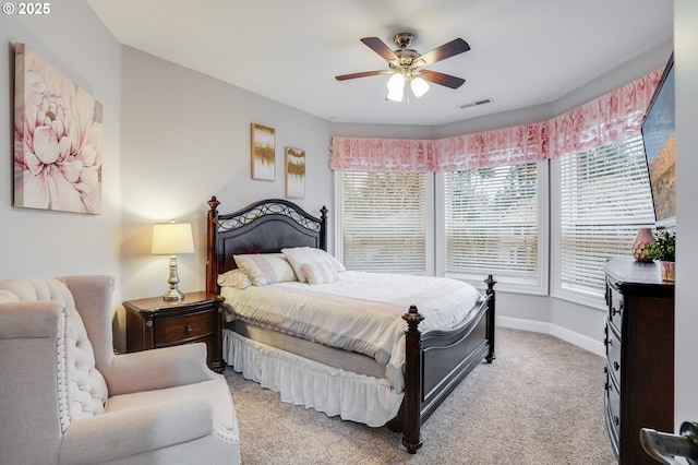 bedroom with light colored carpet and ceiling fan