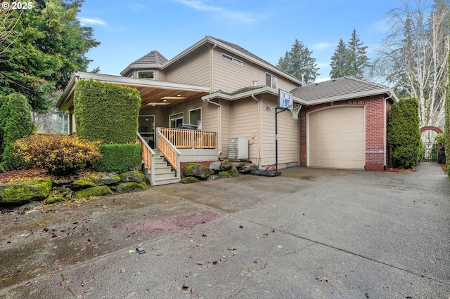 view of front of property with a porch and a garage