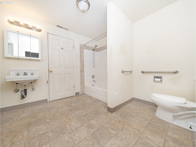 full bathroom featuring sink, shower / washtub combination, and toilet