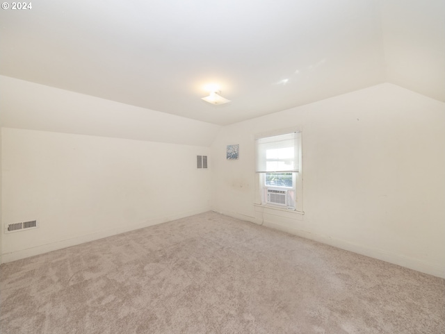 bonus room featuring carpet floors and lofted ceiling