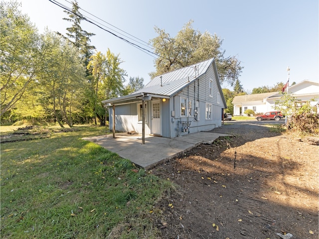 rear view of house with a yard