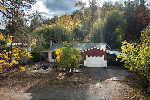 view of front facade with a water view and a garage