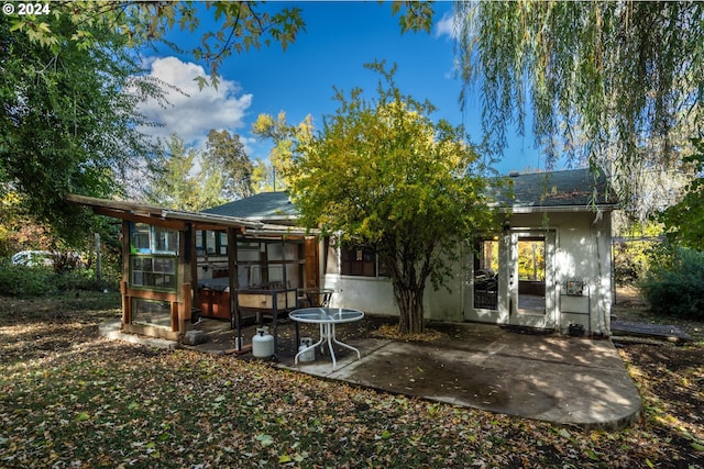 back of property with a patio area