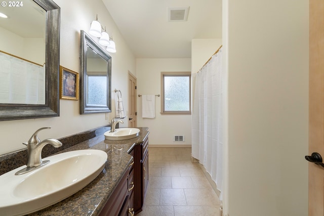 bathroom with vanity and tile patterned floors