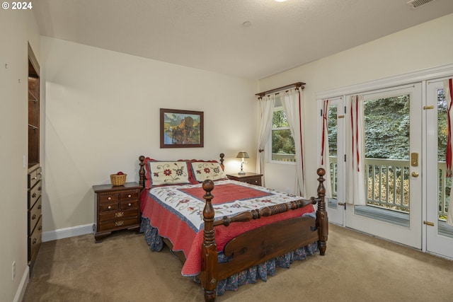 bedroom featuring carpet flooring and access to exterior