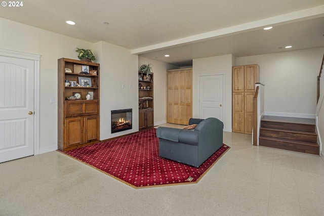 living room with a textured ceiling