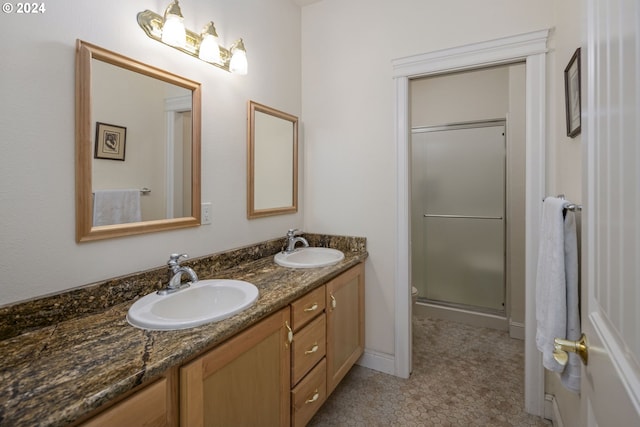 bathroom featuring tile patterned floors, vanity, toilet, and an enclosed shower