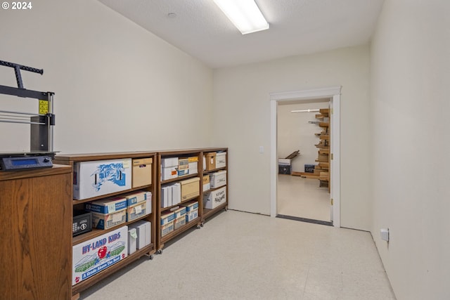 interior space with a textured ceiling