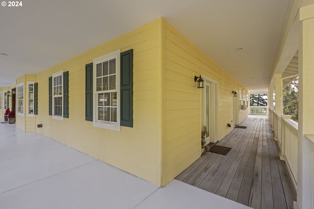 view of side of home featuring a porch