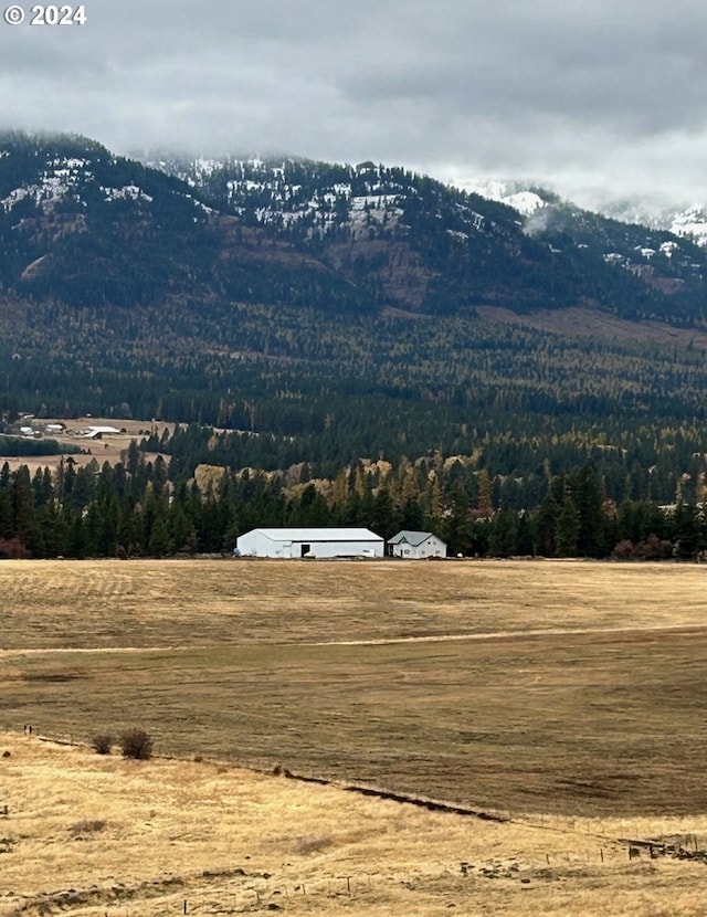 property view of mountains featuring a rural view