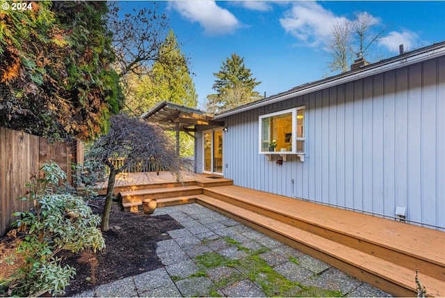 wooden terrace with a patio